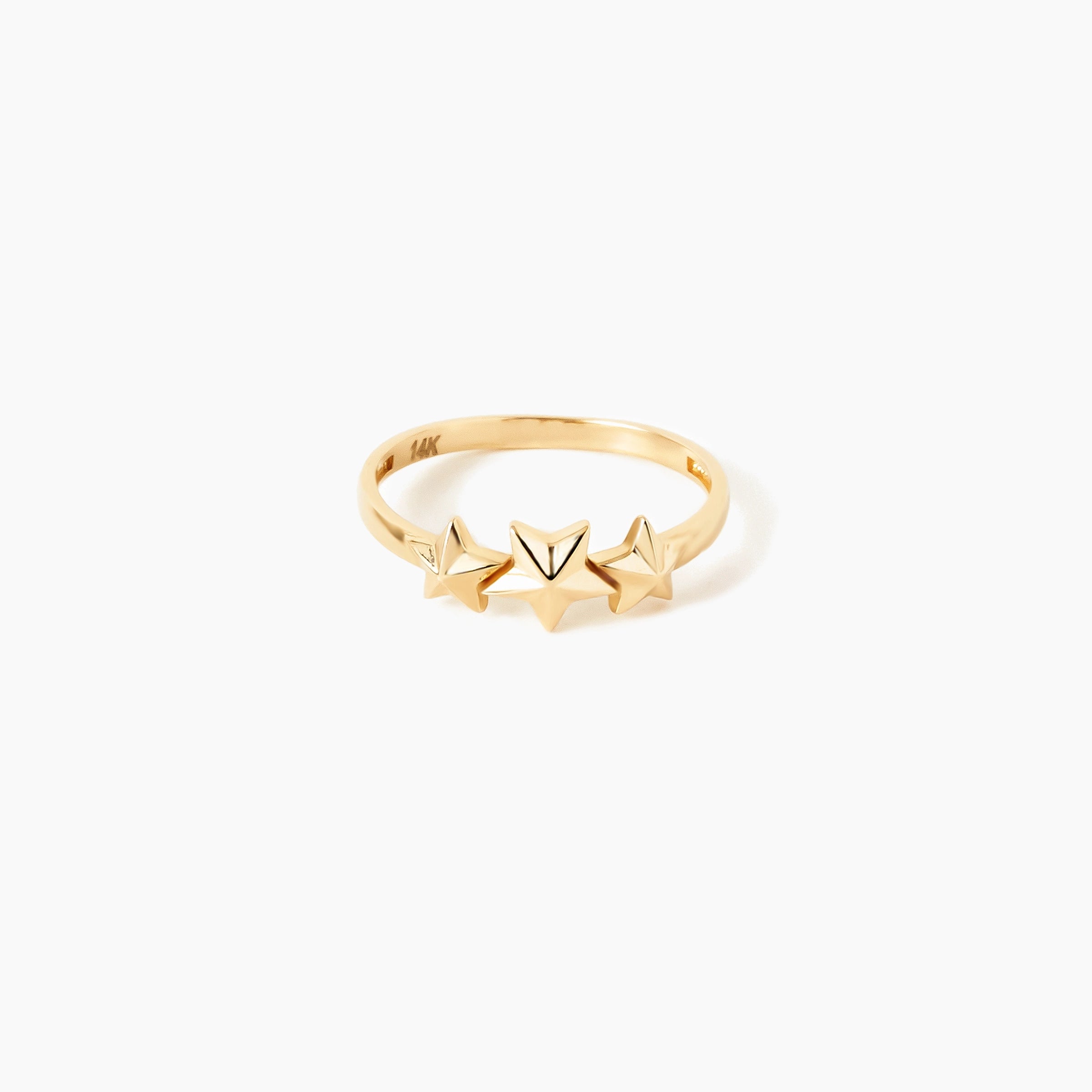 Astra 14K Goldring mit drei polierten Sternenmotiven auf schmaler Schiene. Hochglanzpoliert, Größen 52-58.