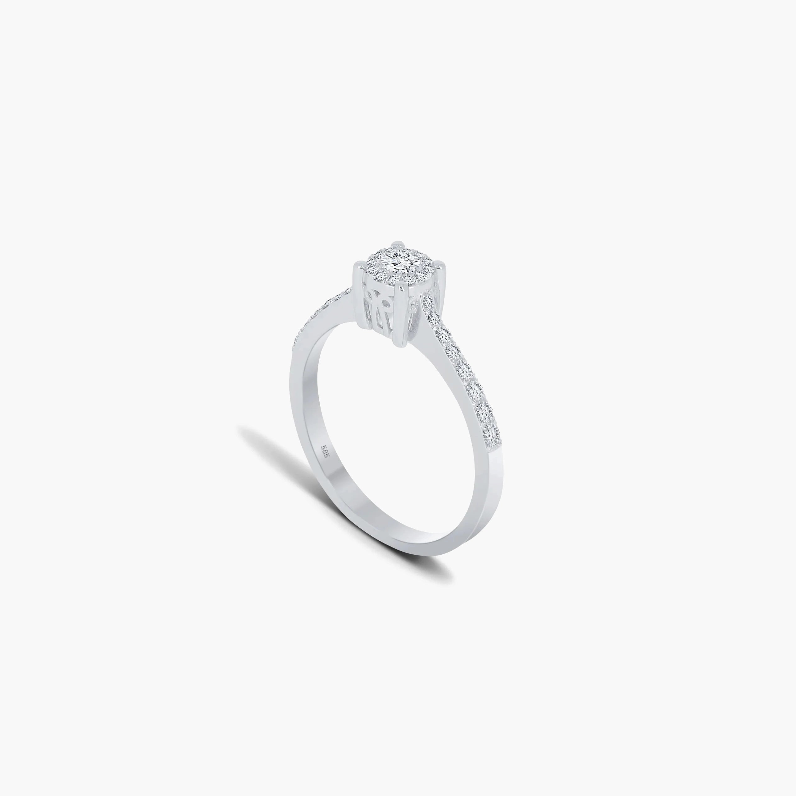 Eleganter Verlobungsring von Anadolu Juweliere mit einem runden Diamanten und einem Halo aus kleineren Diamanten, in Weißgold oder Platin gefasst, luxuriösen Schmuck in Düsseldorf präsentierend.